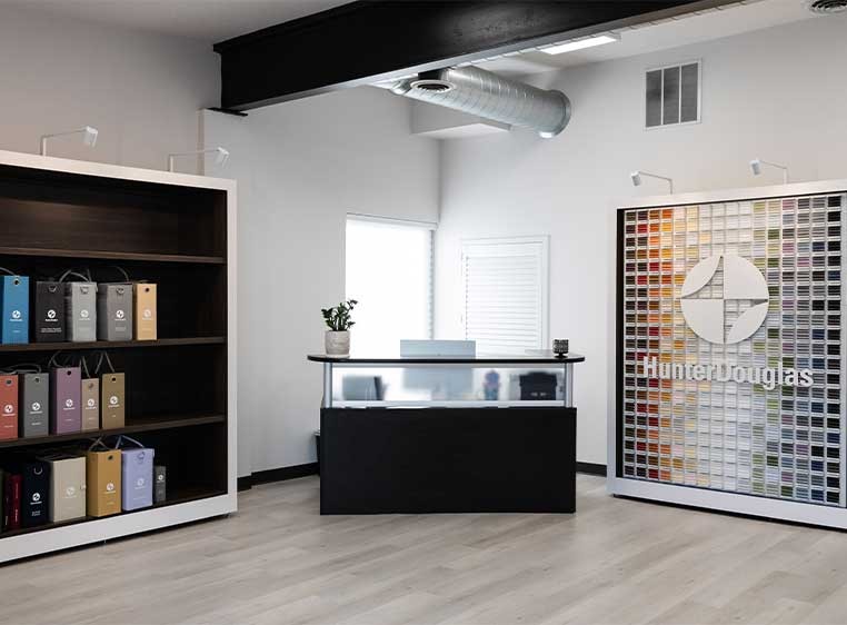 Store interior showcasing several different types of window coverings