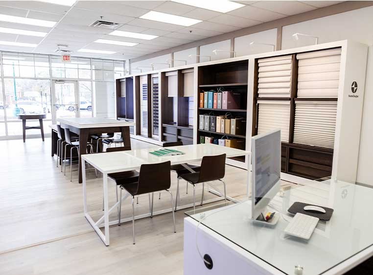 Store interior showcasing several different types of window coverings