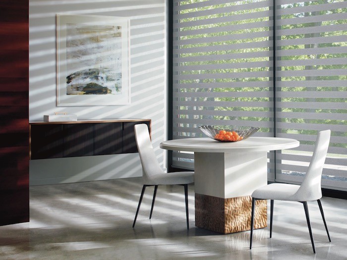 A dining room with a wall-mounted cabinet.